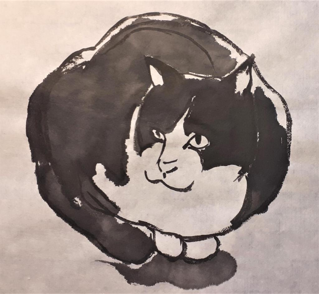 A black and white ink drawing of a round, fluffy cat with distinct facial features and a playful expression.